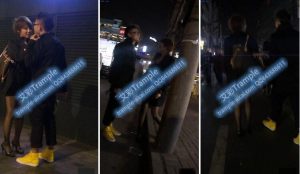 男m被美女用狗链子在大街上牵的走